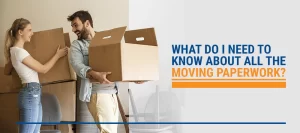 Couple laughing and carrying moving boxes